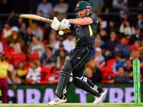 Australia's Aaron Finch plays a shot off Odean Smith of West Indies during the opening cricket match of Twenty20 series between Australia and West Indies at Metricon Stadium, Gold Coast on October 5, 2022.