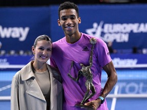 Canada's Felix Auger-Aliassime poses with his girlfriend Nina after winning the men's single final match at the ATP European Open Tennis tournament in Antwerp on October 23, 2022.