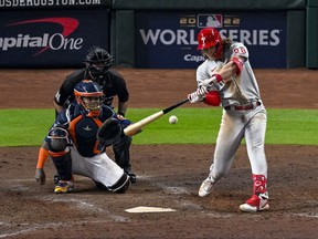 Oct 29, 2022; Houston, Texas, USA; Philadelphia Phillies third baseman Alec Bohm (28) hits a double against the Houston Astros during the ninth inning during game two of the 2022 World Series at Minute Maid Park.
