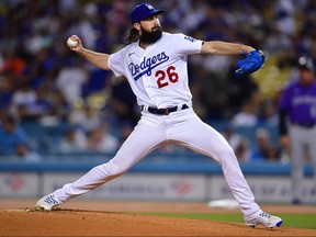 October 3, 2022; Los Angeles, California, USA;  Los Angeles Dodgers starting pitcher Tony Gonsolin (26) throws against the Colorado Rockies during the first inning at Dodger Stadium.
