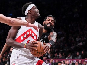Nets guard Kyrie Irving attempts to steal the ball from  Raptors forward Pascal Siakam during the second quarter at Barclays Center on Friday, Oct. 21. Siakam had a triple-double, Irving 30 points, as the Nets won 109-105.