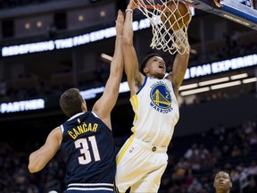 Oct 14, 2022; San Francisco, California, USA;  Golden State Warriors guard Ryan Rollins (2) shoots as Denver Nuggets forward Vlatko Cancar (31) defends during the second half at Chase Center.
