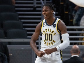 Oct 12, 2022; Indianapolis, Indiana, USA; Indiana Pacers guard Bennedict Mathurin (00) reacts to an and one play in the first half against the New York Knicks at Gainbridge Fieldhouse.