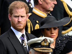 Prince Harry, Duke of Sussex, and wife Meghan, Duchess of Sussex, attend the state funeral and burial of Queen Elizabeth in London, Sept. 19, 2022.