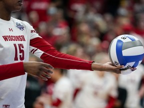 Wisconsin's Jade Demps (15) prepares to serve the ball during the championship match of the NCAA women's college volleyball tournament against Nebraska Saturday, Dec. 18, 2021, in Columbus, Ohio.