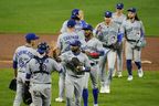 Blue Jays players celebrate a doubleheader sweep against the Orioles in Baltimore early last month. The Blue Jays head into the wild-card series having won 22 of their past 33 games since the start of September. 
