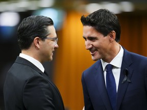 Prime Minister Justin Trudeau and Conservative Leader Pierre Poilievre greet each other as they gather in the House of Commons on Parliament Hill in Ottawa on Thursday, Sept. 15, 2022.