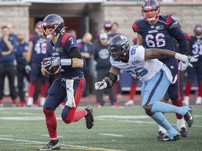 Montreal Alouettes quarterback Trevor Harris (7) runs for yards during first half CFL football action against the Toronto Argonauts in Montreal, Saturday, October 22, 2022.
