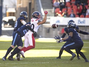 Toronto Argonauts defensive back Shaq Richardson intercepts a pass intended for Montreal Alouettes receiver Cole Spieker  during first half CFL football action in Toronto, Saturday, October 29, 2022.
