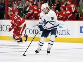 Toronto Maple Leafs' Rasmus Sandin moves the puck against the Detroit Red Wings during the second period of an NHL preseason hockey game, Friday, Oct. 7, 2022, in Detroit.