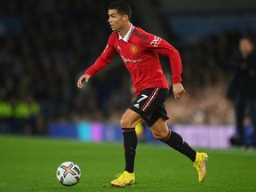 Cristiano Ronaldo of Manchester United runs with the ball during the Premier League match between Everton FC and Manchester United at Goodison Park on Oct. 9, 2022 in Liverpool, England.