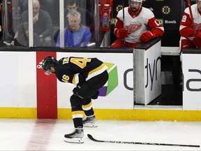 Boston Bruins centre David Krejci hunches over and leaves the ice after being injured against the Detroit Red Wings during the second period at TD Garden in Boston, Oct. 27, 2022.