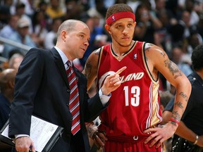Assistant Coach John Kuester of the Cleveland Cavaliers talks to his player Delonte West in Game 4 of the Eastern Conference Semifinals against the Atlanta Hawks during the 2009 NBA Playoffs at Philips Arena on May 11, 2009 in Atlanta, Ga.