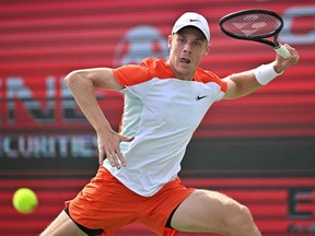 Denis Shapovalov hits a return against Jenson Brooksby during their semifinal match at the Korea Open Tennis Championships in Seoul, Saturday, Oct. 1, 2022.