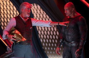Pierce Brosnan and Dwayne Johnson in a scene from Black Adam.