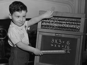 Boy points at blackboard with ruler in a classroom, circa 1950. (Photo by George Marks/Retrofile/Getty Images)