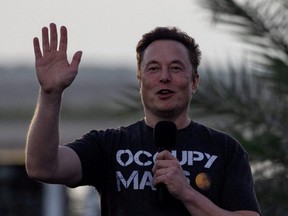 Elon Musk, chief executive of Tesla and of SpaceX, gestures during a joint news conference with T-Mobile CEO Mike Sievert (not shown) at the SpaceX Starbase, in Brownsville, Texas, Aug. 25, 2022.