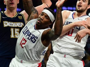 Los Angeles Clippers guard Eric Bledsoe plays for the ball against Denver Nuggets during the second half at Crypto.com Arena in Los Angeles, Calif., Dec. 26, 2021.