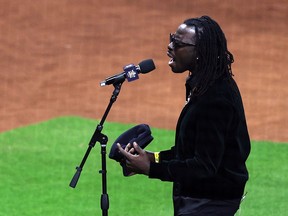 Musician Eric Burton sings the national anthem before Game 1  of the 2022 World Series between the Philadelphia Phillies and the Houston Astros at Minute Maid Park on Oct. 28, 2022 in Houston, Texas.