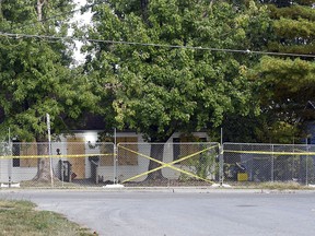 Police tape blocks off the Excelsior Springs residence of Timothy M. Haslett Jr., after the home was boarded up and fenced off Monday, Oct. 10, 2022, in Excelsior Springs, Mo.