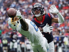 Oct 2, 2022; Houston, Texas, USA; Los Angeles Chargers wide receiver Mike Williams (81) attempts to make a catch as Houston Texans cornerback Derek Stingley Jr. (24) defends during the third quarter at NRG Stadium.
