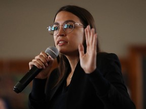 Rep. Alexandria Ocasio-Cortez (D-NY) speaks during a campaign event with Democratic presidential candidate Sen. Bernie Sanders (I-VT) at La Poste January 26, 2020 in Perry, Iowa. 
 (Photo by Chip Somodevilla/Getty Images)