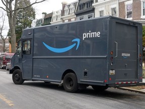 An Amazon Prime truck during a delivery (Photo by NICHOLAS KAMM/AFP via Getty Images)