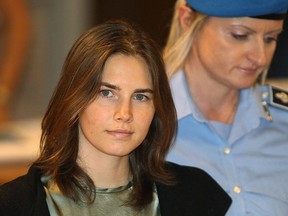 Amanda Knox is escorted to her appeal hearing at Perugia's Court of Appeal on September 29, 2011 in Perugia, Italy. Amanda Knox and Raffaele Sollecito are awaiting the verdict of their appeal that could see their conviction for the murder of Meredith Kercher overturned. (Photo by Oli Scarff/Getty Images)