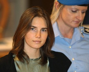 Amanda Knox is escorted to her appeal hearing at Perugia's Court of Appeal on September 29, 2011 in Perugia, Italy. Amanda Knox and Raffaele Sollecito are awaiting the verdict of their appeal that could see their conviction for the murder of Meredith Kercher overturned. (Photo by Oli Scarff/Getty Images)