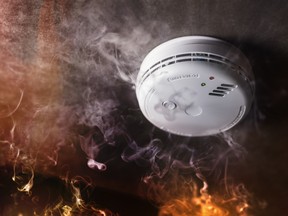 Smoke detector and fire alarm in action.