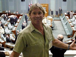 Australian television personality Steve Irwin wearing his trademark shorts arrives to hear the speech by U.S. President George W Bush to the Australian national parliament in Canberra 23 October 2003. (DAVID GRAY/AFP via Getty Images)