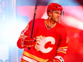 Oct 13, 2022; Calgary, Alberta, CAN; Calgary Flames center Jonathan Huberdeau (10) during player introduction prior to the game between the Calgary Flames and the Colorado Avalanche at Scotiabank Saddledome.