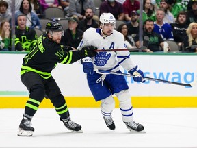 Apr 7, 2022; Dallas, Texas, USA; Dallas Stars center Luke Glendening (11) defends against Toronto Maple Leafs center Auston Matthews (34) during the first period at the American Airlines Center. Mandatory Credit: Jerome Miron-USA TODAY Sports