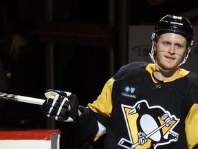 Oct 15, 2022; Pittsburgh, Pennsylvania, USA;  Pittsburgh Penguins left wing Jake Guentzel (59) reacts after being named first star of the game against the Tampa Bay Lightning at PPG Paints Arena. The Penguins won 6-2.