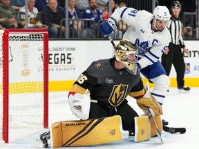 Oct 24, 2022; Las Vegas, Nevada, USA; Toronto Maple Leafs center John Tavares (91) attempts a deflection past Vegas Golden Knights goaltender Logan Thompson (36) during the first period at T-Mobile Arena.