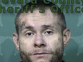 The Massachusetts man had been hiding under a pile of clothes and garbage, the Brevard Country Sheriff's Office said.