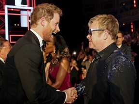 Britain's Prince Harry greets Elton John after the Royal Variety Performance at Albert Hall in London, Nov. 13, 2015.