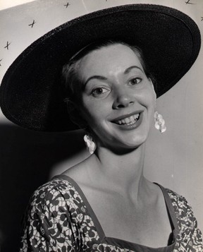 Joan Sutton Straus poses in a stylish chapeau, circa 1954.