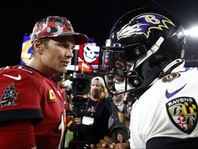 Tom Brady of the Tampa Bay Buccaneers and Lamar Jackson of the Baltimore Ravens meet on the field after their game at Raymond James Stadium on Oct. 27, 2022 in Tampa, Fla.