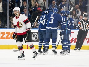 Toronto Maple Leafs centre David Kampf (64) celebrates with his teammates after scoring a goal against the Ottawa Senators during the second period at Scotiabank Arena.