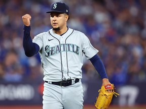 Luis Castillo #21 of the Seattle Mariners reacts at the end of the sixth inning during Game One of the AL Wild Card series against the Toronto Blue Jays at Rogers Centre.