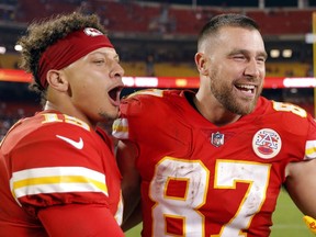 Chiefs quarterback Patrick Mahomes, left, and tight end Travis Kelce, right, celebrate after defeating the Raiders 30-29 at Arrowhead Stadium in Kansas City, Mo., Monday, Oct. 10, 2022.