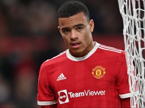 In this file photo taken on Jan. 3, 2022, Manchester United's English striker Mason Greenwood is substituted during the English Premier League football match between Manchester United and Wolverhampton Wanderers at Old Trafford in Manchester, northwest England.