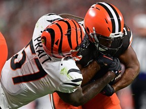 Browns running back Nick Chubb (right) runs through Bengals linebacker Germaine Pratt (left) to score a two-point conversion during second quarter NFL action at FirstEnergy Stadium in Cleveland, Monday, Oct 31, 2022.