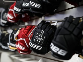 Bauer hockey gloves are displayed for sale at an equipment store in Toronto, Ontario, Canada, on Monday, Oct. 31, 2016.