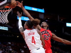 Toronto Raptors centre Christian Koloko (35) blocks a shot attempt by Houston Rockets guard Jalen Green (4) during the first quarter at Toyota Center.