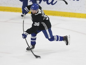 Maple Leafs defenceman Rasmus Sandin, skating with veteran Jake Muzzin, played his off side during practice on Sunday.