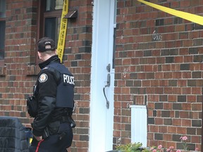 A Toronto Police officer protects the crime scene on Shenley Rd. where a wanted 35-year-old Scarborough man fired close to 20 bullets at undercover officers at a Shenley Rd. home north of Eglinton Ave. E. and Kennedy Rd. around 8:30 p.m. Tuesday night.