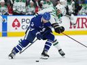 Dallas Stars forward Mason Marchment battles with Toronto Maple Leafs defenceman Justin Holl during the second period at Scotiabank Arena on Oct. 20, 2022.