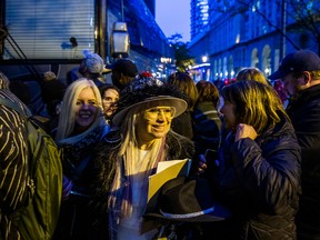 Eve Fischer (centre), was among the many fans outside the stage doors to Meridian Hall  hoping to catch a glimpse of Johnny Depp at Meridian Hall in Toronto on Monday Oct. 17, 2022. Depp was a special guest of British guitar legend Jeff Beck, who performed at the venue.